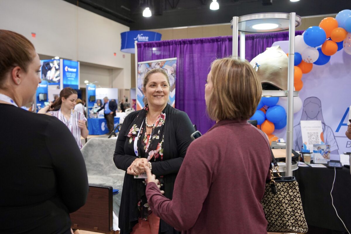 Amy Cowperthwait welcomes Simulation conference attendees to the Avkin booth. Healthcare Simulation Conferences 2025