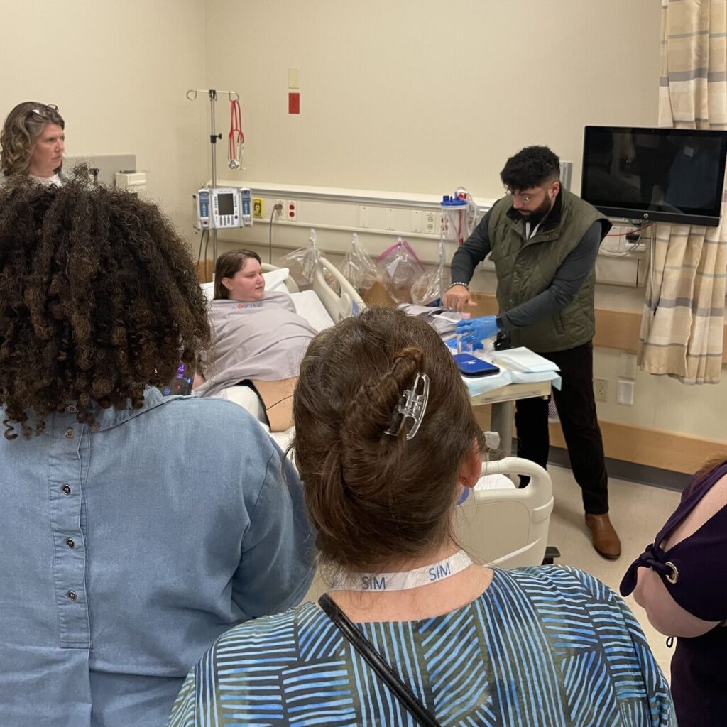 Royce Townsend, Solutions Consultant at Avkin Inc, helps demostrate the gold standard of maternal fetal simulation education, Avbirth.