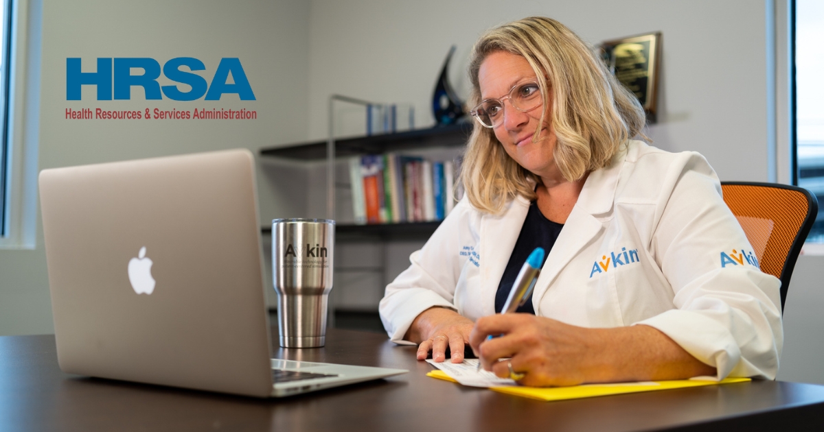 SImulationist sitting in office filling out grant paperwork